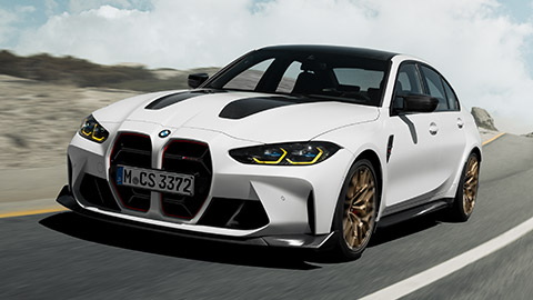 Modèles BMW M, BMW M3 CS G80 vue de trois quarts avant en mouvement sur la route